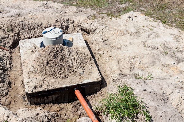 during septic tank pumping, a professional will remove the solid waste and sludge from the tank to prevent buildup